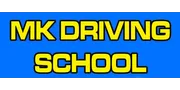 M K Driving School logo